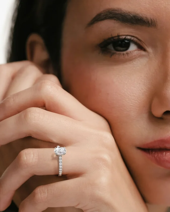 Amora Oval 1.00ct Hidden Halo Diamond Engagement Ring With Side Stones Set in 18K White Gold